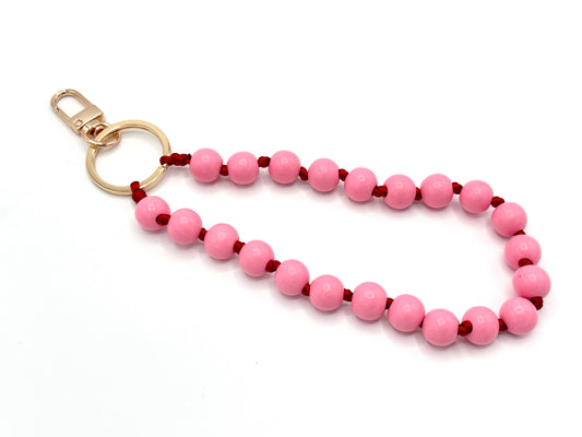Schlüsselanhänger aus Holzperlen mit Karabiner Rosa/Rot